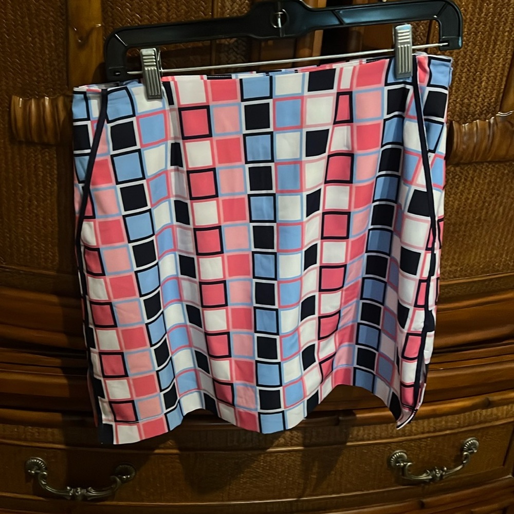 Golftini SZ 4 Geometri Windowpane skort in Blues and Pinks with ribbon detail.